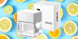 Perfume Colcci White Água de Cheiro sobre um fundo com frutas cítricas